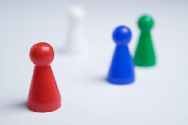 istock Group of colored pawns on a white background 1125719161