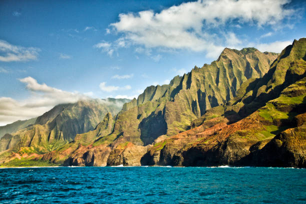 Mysterious Misty Na Pali Coast and Waimea Canyon, Kauai, Hawaii The scenic view of the Na Pali Coast and the Waimea Canyon of Kauai, Hawaii. north shore stock pictures, royalty-free photos & images