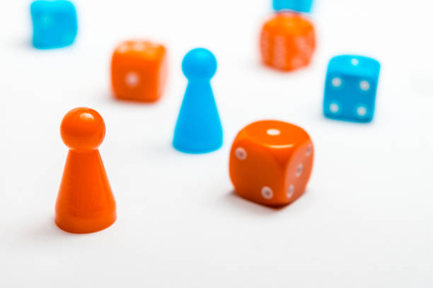istock Pawns and colored dice for board games 1125719495