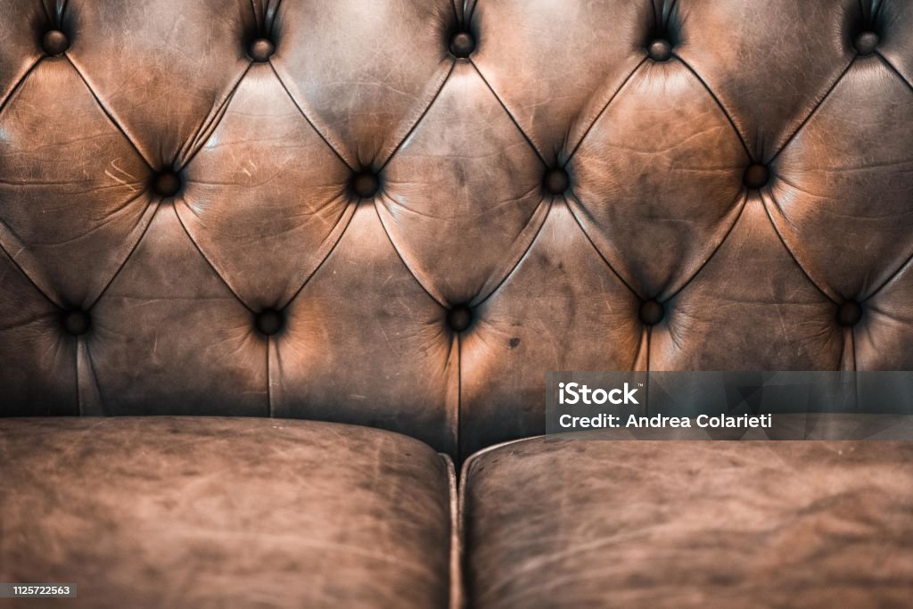 Detail of a luxurious brown leather sofa Sofa Stock Photo