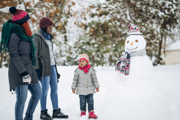 istock Family at snow making a snowman 1125722898