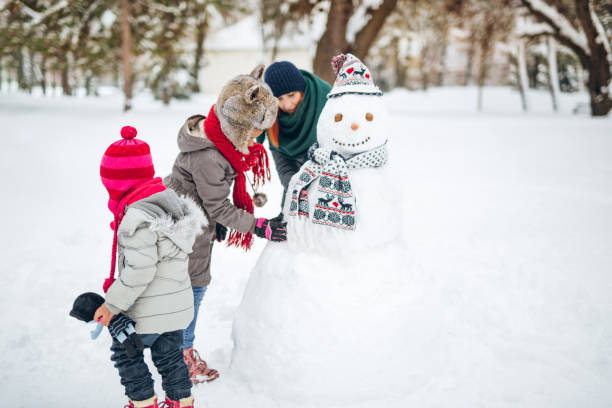 istock Family at snow making a snowman 1125722903