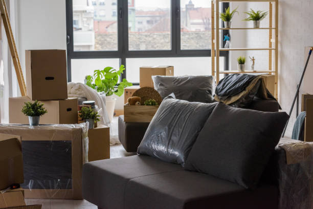 istock Packed cardboard boxes and stuff during moving to new home 1125724036