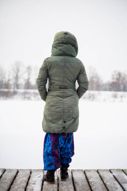 istock Woman stands at the piped-in lake 1125724187