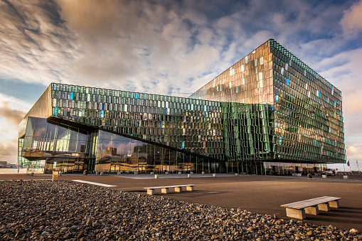 The Harpa building was designed by Henning Larsen Architects and Batteriið Architects, inspired by volcanic basalt columns in creating the glass building facade.