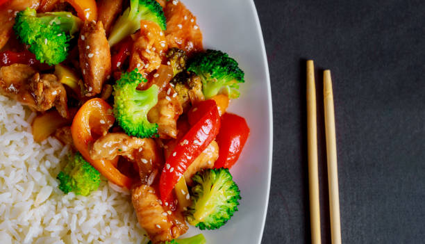 istock Teriyaki chicken sauce rice with vegetables sprinkled with sesame seeds 1125725413