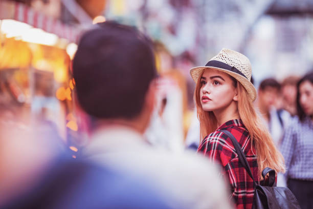 istock Admiring Shopping District While Walking on the Busy Street 1125725547