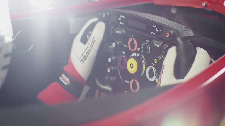 Young sportsperson holding steering wheel in car