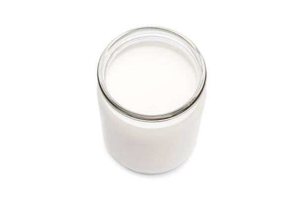 istock Glass jar with milk on white background. 1125728717