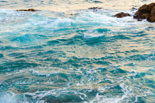 istock Clean, clear sea water hits stones 1125728944