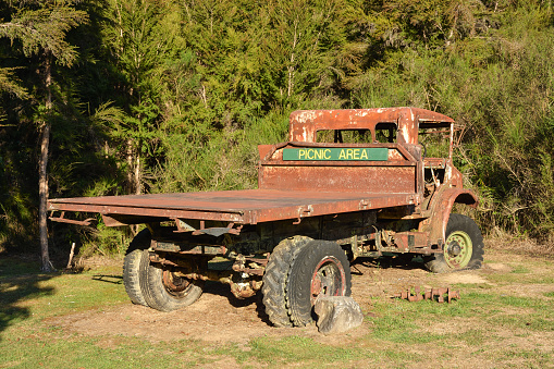 Old abandoned rusty truck, ideal place to take quick picnic in the nature