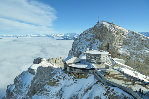 Pilatus, Switzerland - January 1, 2019: People enjoying beautiful views on Swiss Alps on top of Mount Pilatus in Switzerland during the 1st day of New Year 2019