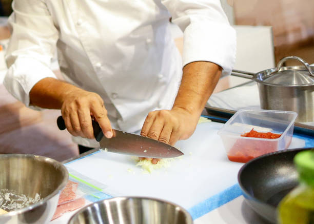 istock Chef cooking food in the kitchen, Chef preparing food 1125731994