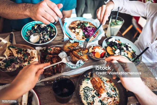 Enjoying Lunch With Friends Stock Photo - Download Image Now - Food, Restaurant, Friendship
