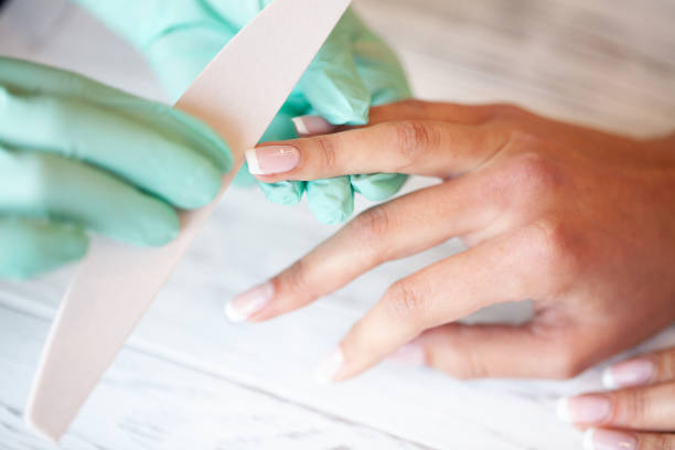 istock Professional manicure procedure. Nails master doing manicure in beauty studio 1125734233