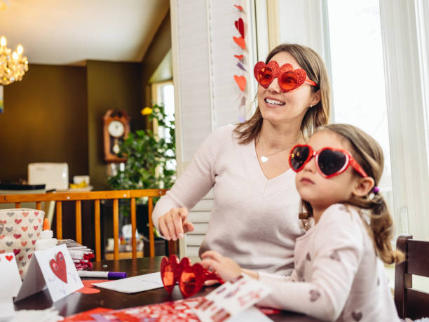 istock Mother and young daughter crafting for Valentine's Day 1125734616