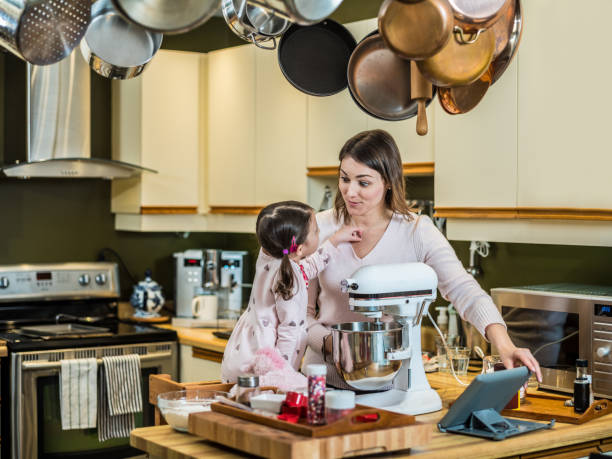 istock Mother and young daughter baking for Valentine's Day 1125734921