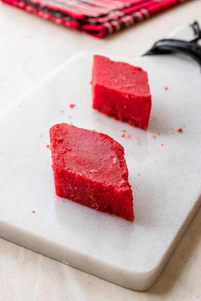 istock Crystallized Turkish Delight Red Sugar. Crystal Confectionery Nobet Sekeri on White Marble Surface. 1125739308