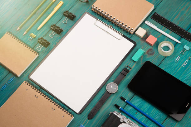istock Workplace with tablet pc, camera, watch and other office supply 1125739455