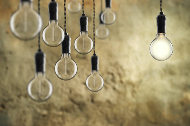 istock Idea and teamwork concept Vintage  bulbs on wall background 1125739602