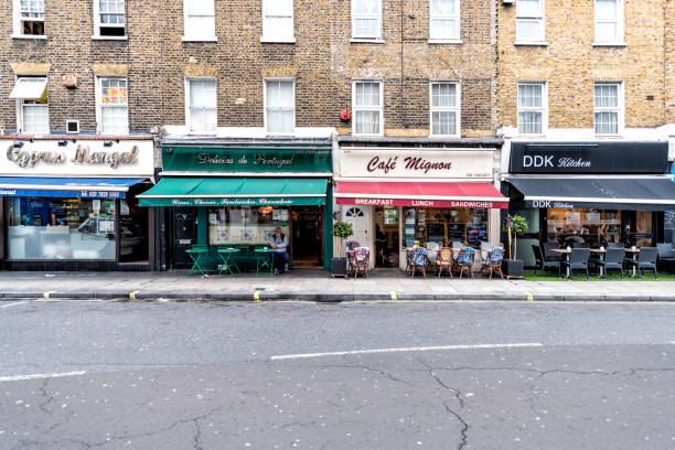 Neighborhood of Pimlico Street with empty road and vintage old stores shops cafe restaurants with nobody London, UK - September 12, 2018: Neighborhood of Pimlico Street with empty road and vintage old stores shops cafe restaurants with nobody warwick uk stock pictures, royalty-free photos & images