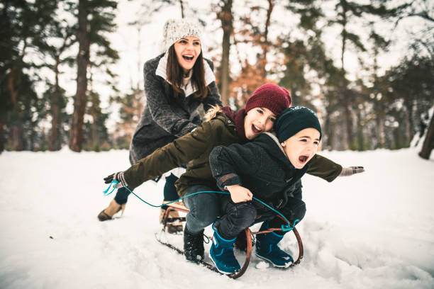 istock Boys With Mum Having Fun On A Sled 1125741058