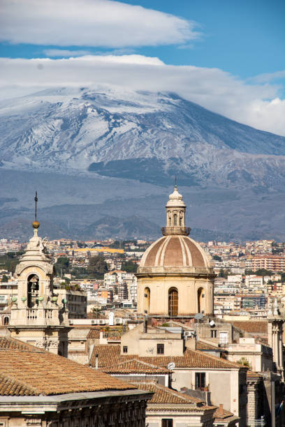 view of the city of Catania with Mount Etna in the background view of the city of Catania with Mount Etna in the background mt etna stock pictures, royalty-free photos & images