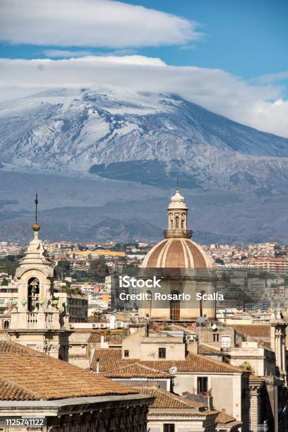 View Of The City Of Catania With Mount Etna In The Background Stock Photo - Download Image Now