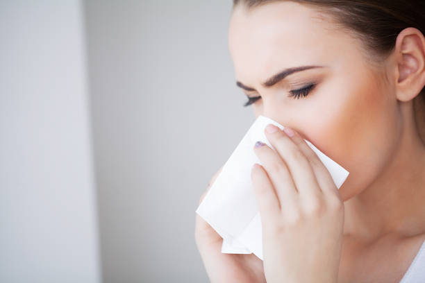 istock Woman Suffering From Cold In Home With Tissue 1125742594
