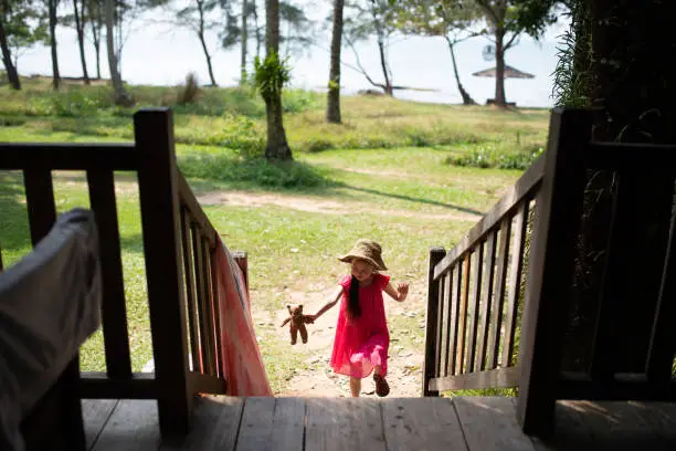 Photo of Girl playing with teddy bear