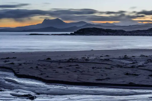 Winter morning on the beach at Mellon Udrigle in Wester Ross Scotland looking over Gruinard Bay and Loch Ewe towards An Teallach in the distance.