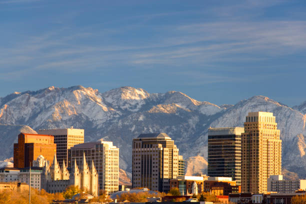 Salt Lake City with Snow Capped Mountain Salt Lake City in winter salt lake city mormon temple utah photos stock pictures, royalty-free photos & images