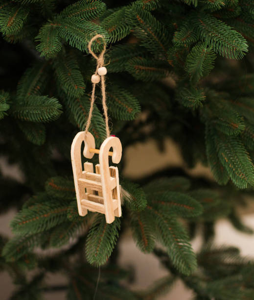 istock Toy, garland on a green Christmas tree 1125744096