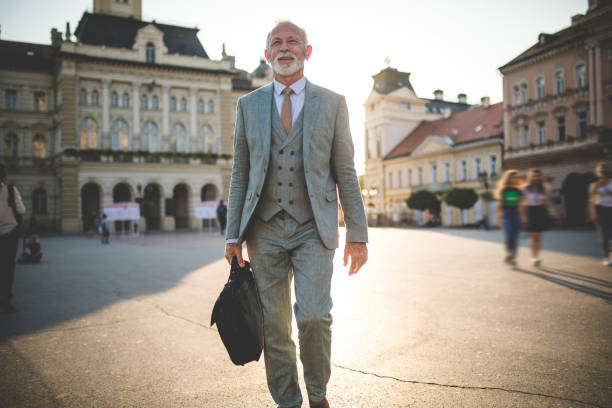 istock Motivated senior entrepreneur on a sunny town square 1125745344