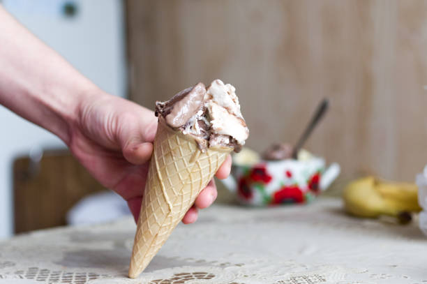 istock Ice cream cone in hand. Homemade ice cream. 1125745477