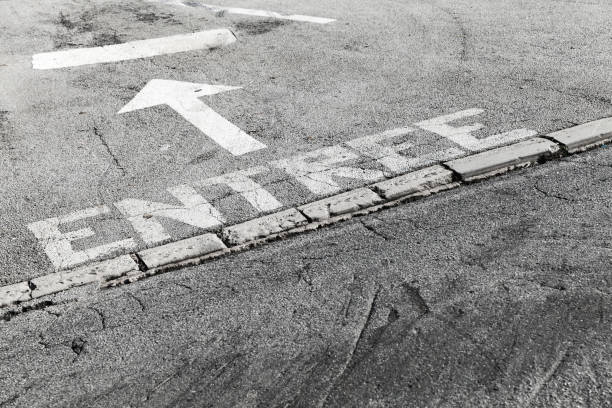 istock French text Entrance, white road marking 1125746611
