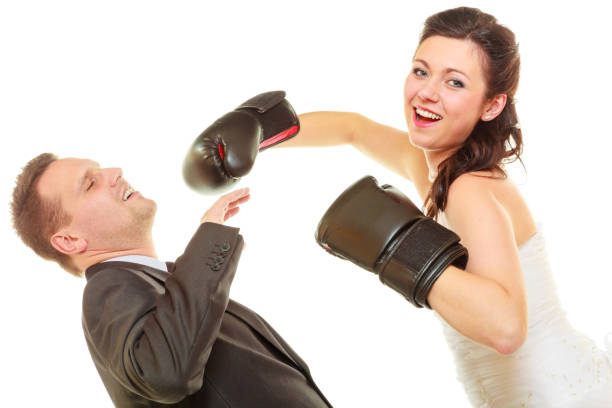 istock Bride boxing her groom on wedding 1125748356