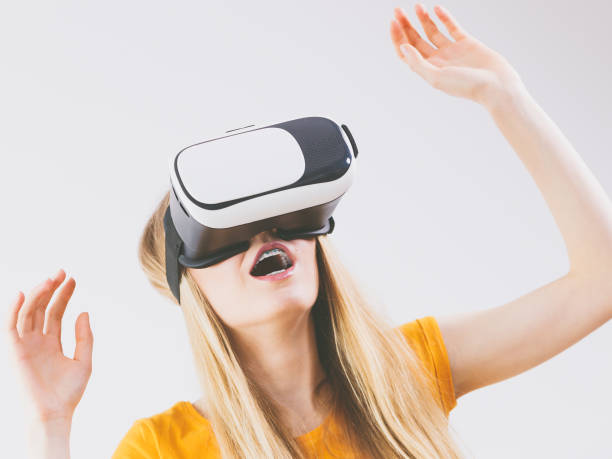 istock Girl wearing virtual reality goggles. 1125748481