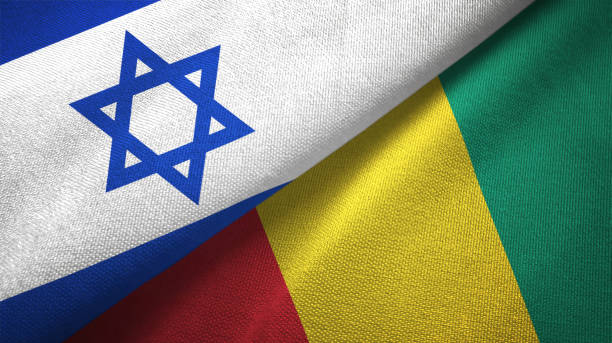 istock Guinea and Israel two flags together textile cloth, fabric texture 1125756719