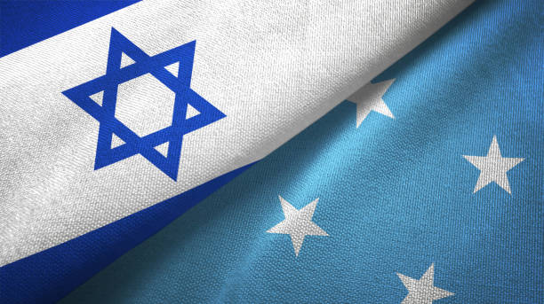 istock Micronesia and Israel two flags together textile cloth, fabric texture 1125756753
