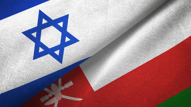 istock Oman and Israel two flags together textile cloth, fabric texture 1125756772