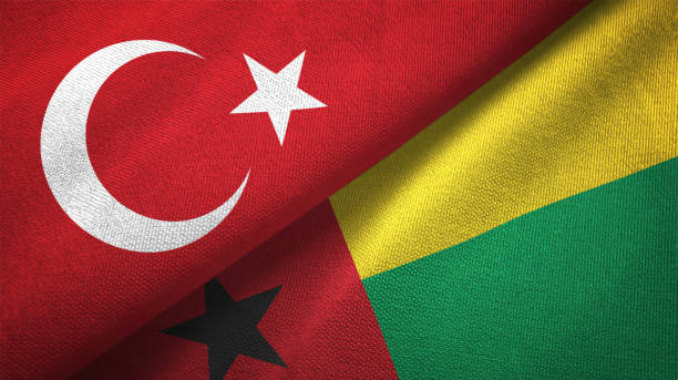 istock Guinea-Bissau and Turkey two flags together textile cloth, fabric texture 1125757350