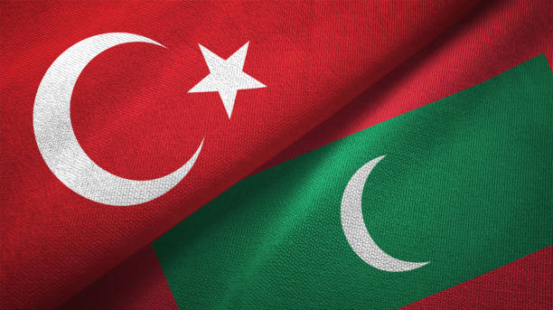 istock Maldives and Turkey two flags together textile cloth, fabric texture 1125757416