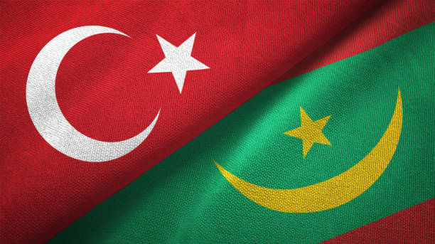 istock Mauritania and Turkey two flags together textile cloth, fabric texture 1125757500