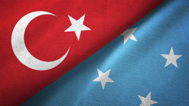istock Micronesia and Turkey two flags together textile cloth, fabric texture 1125757890