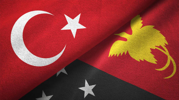 istock Papua New Guinea and Turkey two flags together textile cloth, fabric texture 1125757909