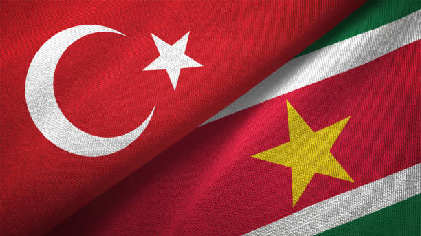 istock Suriname and Turkey two flags together textile cloth, fabric texture 1125757950