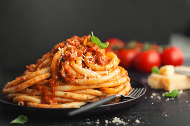 istock Tasty pasta bolognese with cheese and basil 1125758340