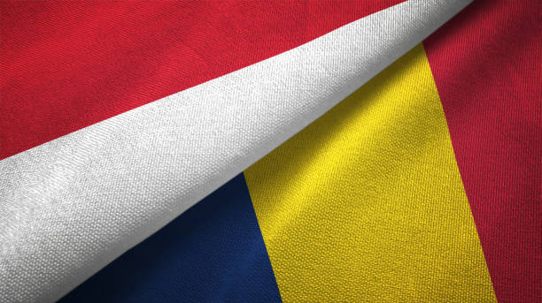 istock Chad and Indonesia two flags together textile cloth, fabric texture 1125758846