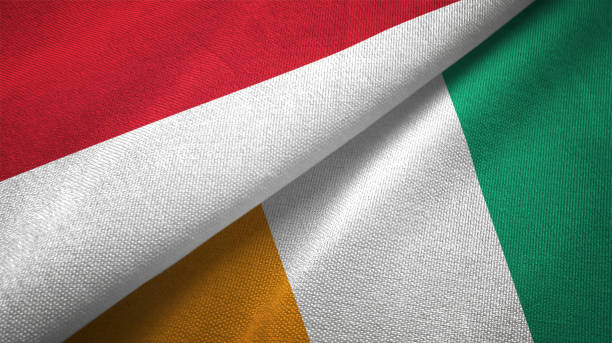 istock Cote d'Ivoire Ivory coast and Indonesia two flags together textile cloth, fabric texture 1125758869